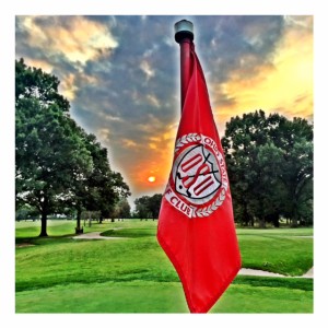 Golf flag at sunset